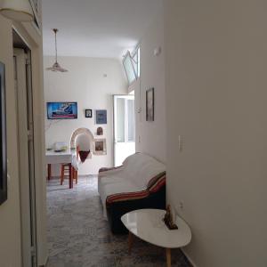 a living room with a couch and a table at Erato Elafonisi in Agios Padeleimon