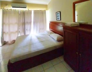 Postel nebo postele na pokoji v ubytování Horison Resort Pondok Layung Anyer