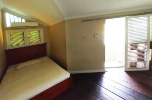 Postel nebo postele na pokoji v ubytování Horison Resort Pondok Layung Anyer