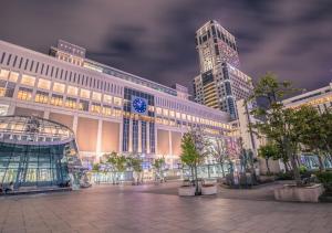 a large building with two tall buildings in a city at Tokyu Stay Sapporo in Sapporo +89 photos