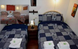 Carlos Guest House 2 Cusco客房内的一张或多张床位