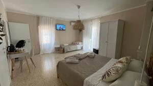 A bed or beds in a room at Santa Lucia Affittacamere