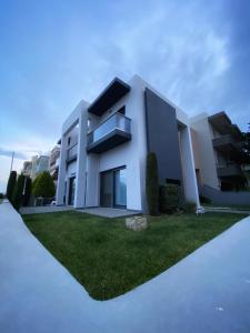 a rendering of a house with a lawn at Nefeli Residence in Alexandroupoli