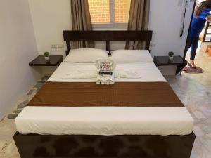 Llit o llits en una habitació de Papa Freds Beach Resort