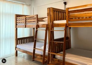 a group of bunk beds in a room at BAAN650 Hostel in Hat Yai