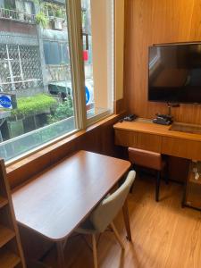 TV a/nebo společenská místnost v ubytování 盤古捷旅 - Panco Hotel