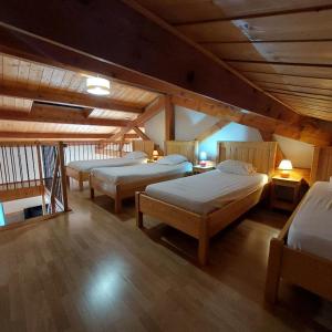 a room with three beds in a attic at Equi'val in Le Tholy