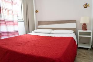Postel nebo postele na pokoji v ubytování Portosalvo Rooms