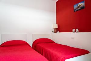 Postel nebo postele na pokoji v ubytování Portosalvo Rooms