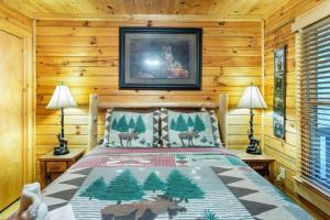 a bedroom with a bed in a log cabin at Mountain Spirit Cabin - Fireplace and Hot Tub in Blue Ridge