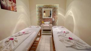Cama ou camas em um quarto em Gemma Resort