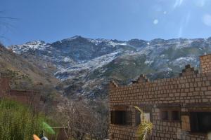 a view of a mountain with snow capped mountains at Room in Lodge - Authentic and pittoresque room for 3 people in Tamatert, Morocco num1 in Tamatert