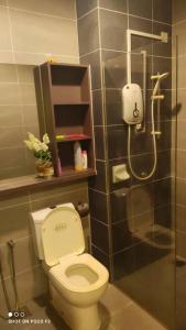a bathroom with a toilet and a shower at HA206 - WI-FI- NETFLIX-PARKING- SWIMMING POOL- CYBERJAYa, 3073 in Cyberjaya