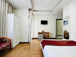 Postel nebo postele na pokoji v ubytování Dalat ECO Hotel 2