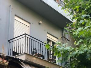 a balcony of a building with a window at Apartment MCS in Igoumenitsa +7 photos