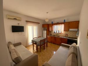 a living room with a couch and a table at Vila Tani in Ksamil