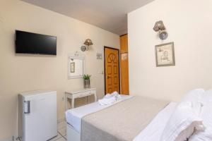 Postel nebo postele na pokoji v ubytování Hotel Magdalena