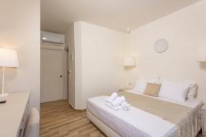 Postel nebo postele na pokoji v ubytování Hotel Magdalena