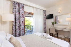 Postel nebo postele na pokoji v ubytování Hotel Magdalena