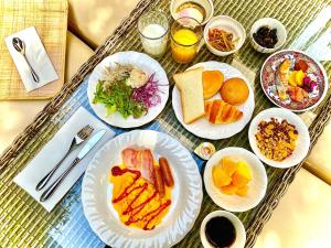 a tray with plates of food on a table at Hotel Rose Garden Shinjuku in Tokyo