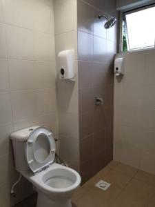 a bathroom with a toilet with the seat up at ForestNest Cameron Town Spacious 3R3B (1300 sqft) in Tanah Rata