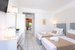 Postel nebo postele na pokoji v ubytování Hotel Magdalena