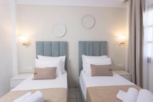 Postel nebo postele na pokoji v ubytování Hotel Magdalena