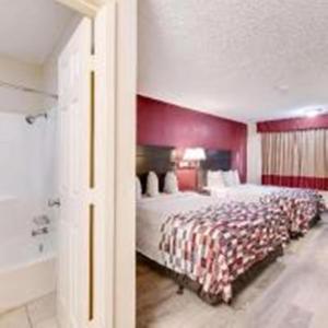 Postel nebo postele na pokoji v ubytování American Inn
