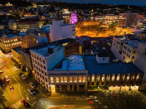 an overhead view of a city at night at Bell Hill Apartments in Dunedin