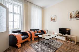 a living room with a couch and a table at Pyvo Street Home with balcony near the Danube in Budapest