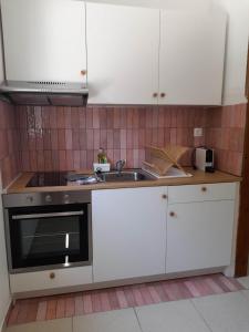 Kuchyň nebo kuchyňský kout v ubytování Lemontree Apartments