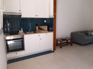 Kuchyň nebo kuchyňský kout v ubytování Lemontree Apartments