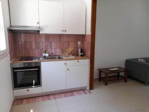 Kuchyň nebo kuchyňský kout v ubytování Lemontree Apartments