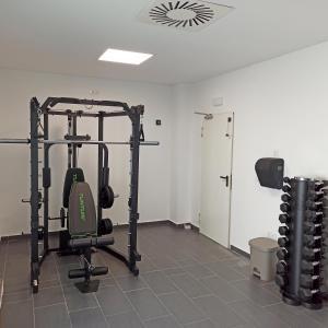 a room with a gym with a squat rack at Complejo Al Sur in Chiclana de la Frontera