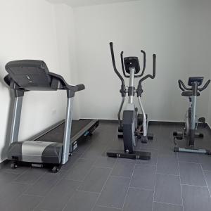 a gym with three exercise bikes in a room at Complejo Al Sur in Chiclana de la Frontera