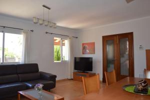 Televízia a/alebo spoločenská miestnosť v ubytovaní Chalet zona relax