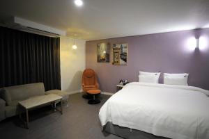 Postel nebo postele na pokoji v ubytování Brighton Hotel
