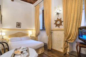 Postel nebo postele na pokoji v ubytování Hotel Fontana