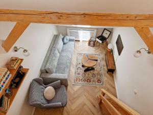 an overhead view of a living room with a couch at Apartmán Singer in Banská Štiavnica
