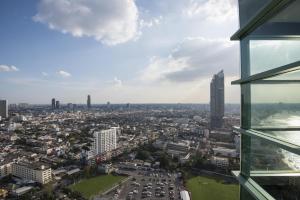 a view of a city from a building at Chatrium Hotel Riverside Bangkok in Bangkok