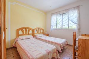 A bed or beds in a room at Marblau 3 Még 15 kép