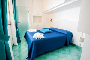 Ein Bett oder Betten in einem Zimmer der Unterkunft Hotel Villa Pandora