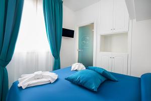 Ein Bett oder Betten in einem Zimmer der Unterkunft Hotel Villa Pandora