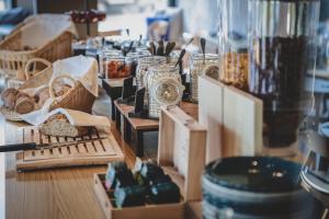 a display of clocks and other items on a table at Aves Arosa in Arosa