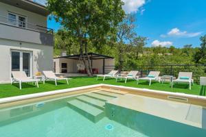 a swimming pool in the yard of a house at Villa Rose in Zagvozd, Makarska hinterland in Zagvozd