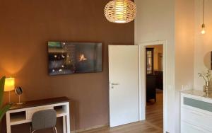 TV a/nebo společenská místnost v ubytování TS Apartments