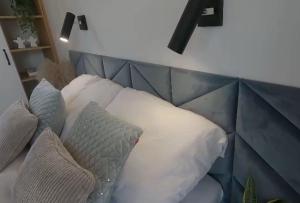 a couch with pillows on it in a living room at Tiny House EMH Peterswald 