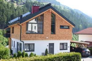 a house in the mountains with a roof at Mountain alpine in Kappl