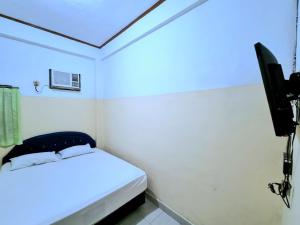 Postel nebo postele na pokoji v ubytování Hotel Taman Sari