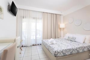 Postel nebo postele na pokoji v ubytování Hotel Magdalena